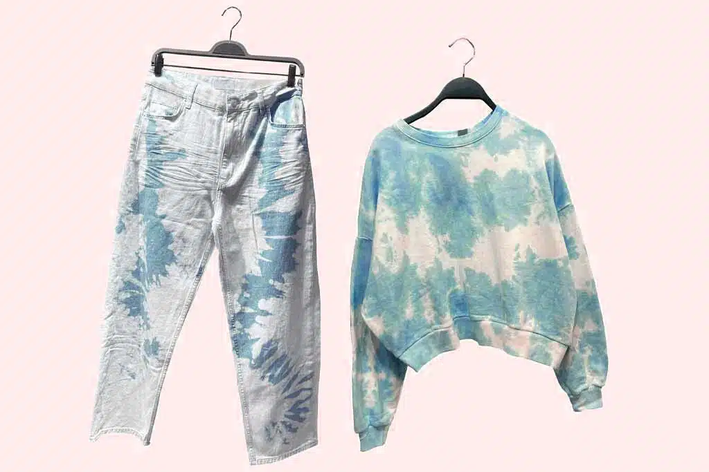 Pair of jeans and a sweater with a bleach pattern